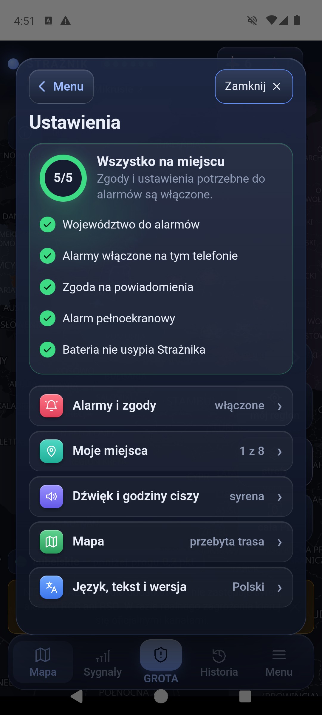 Ekran startowy ustawień otwartych z Menu: karta gotowości 5 z 5 Wszystko na miejscu z pozycjami Województwo do alarmów, Alarmy włączone na tym telefonie, Zgoda na powiadomienia, Alarm pełnoekranowy i Bateria nie usypia Strażnika, pod nią pięć wierszy z bieżącymi wartościami: Alarmy i zgody włączone, Moje miejsca 1 z 8, Dźwięk i godziny ciszy syrena, Mapa przebyta trasa, Język, tekst i wersja Polski, a na górze, obok Zamknij, przycisk ‹ Menu